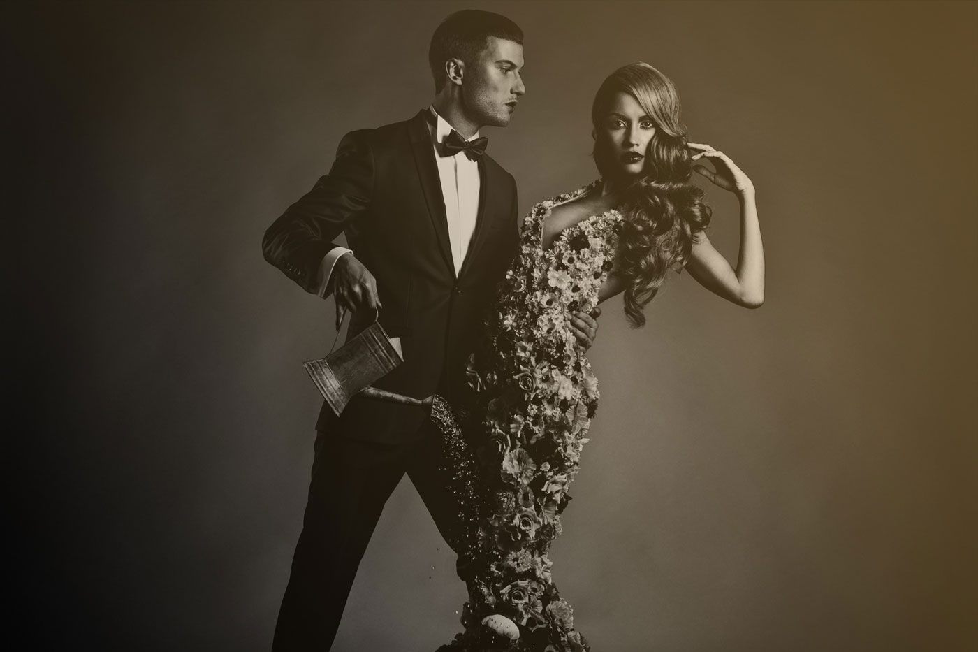 Couple in evening wear: a tailored dinner suit and an embellished gown
